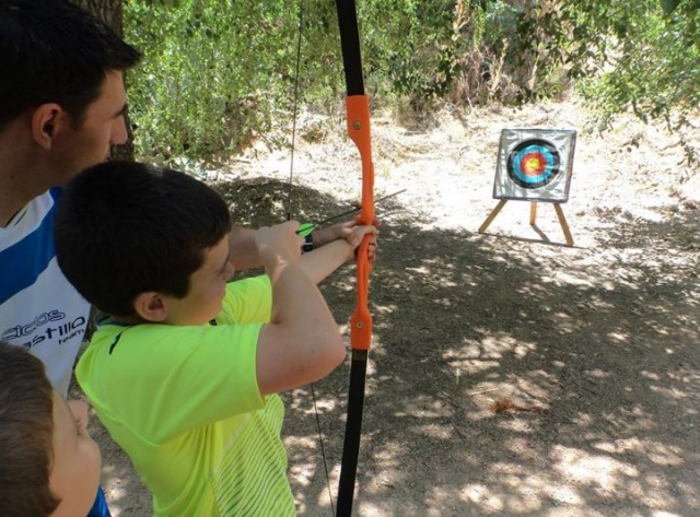  child practicing archery 